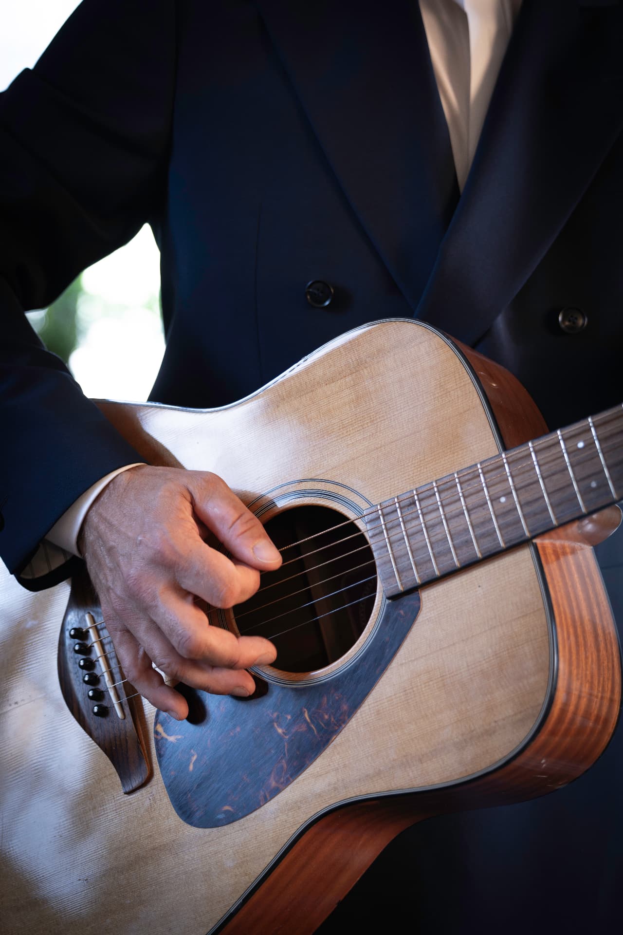 Close-up of an acoustic guitar being played